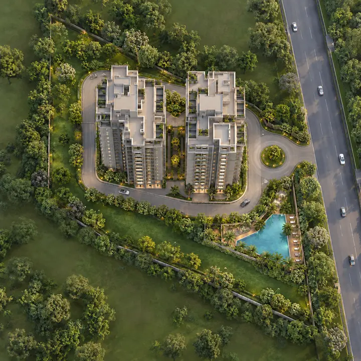 Aparna Shettigere aerial view of two residential blocks with a driveway looping round both blocks and a pool beside them, artist's impression